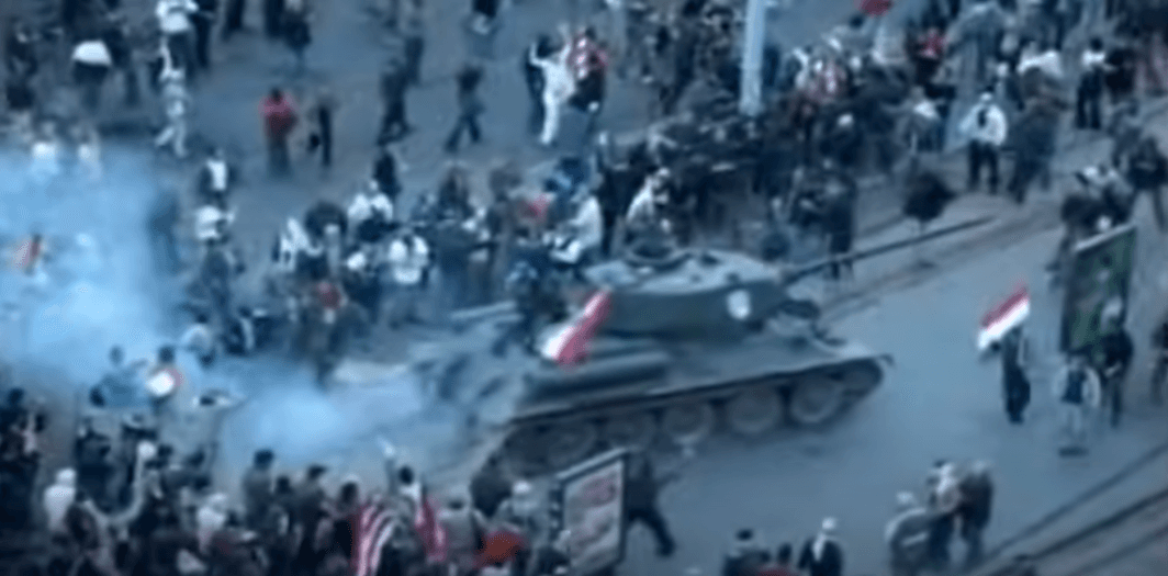 The picture shows a tank being stolen by a protester during an anti-government demonstration in Budapest